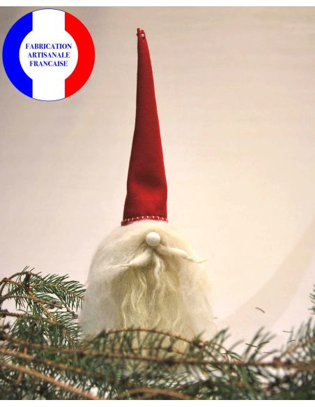 Scandinavian Christmas elf with white wool beard and red wool hat 